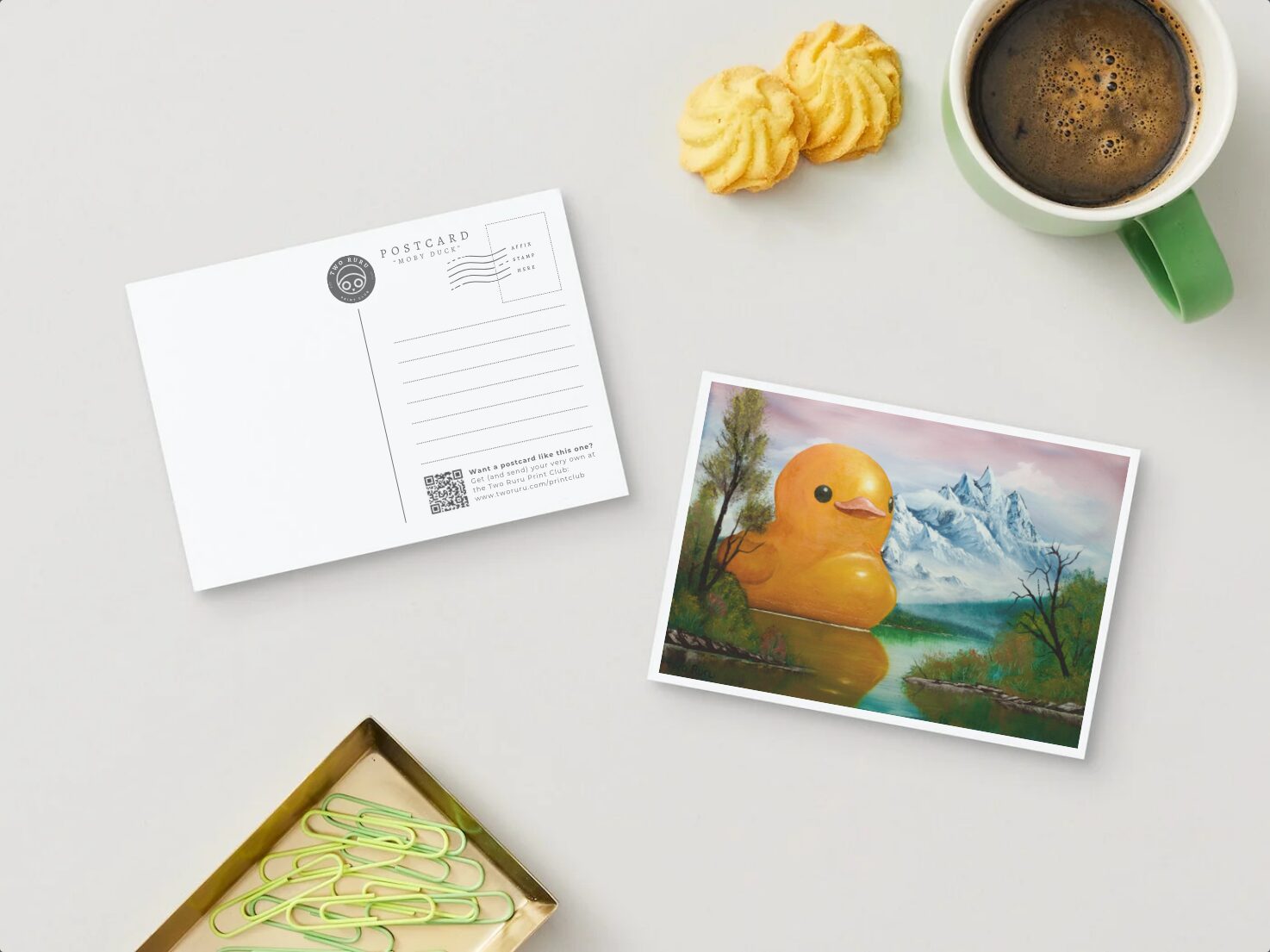 a postcard featuring an enormous duck on a lake